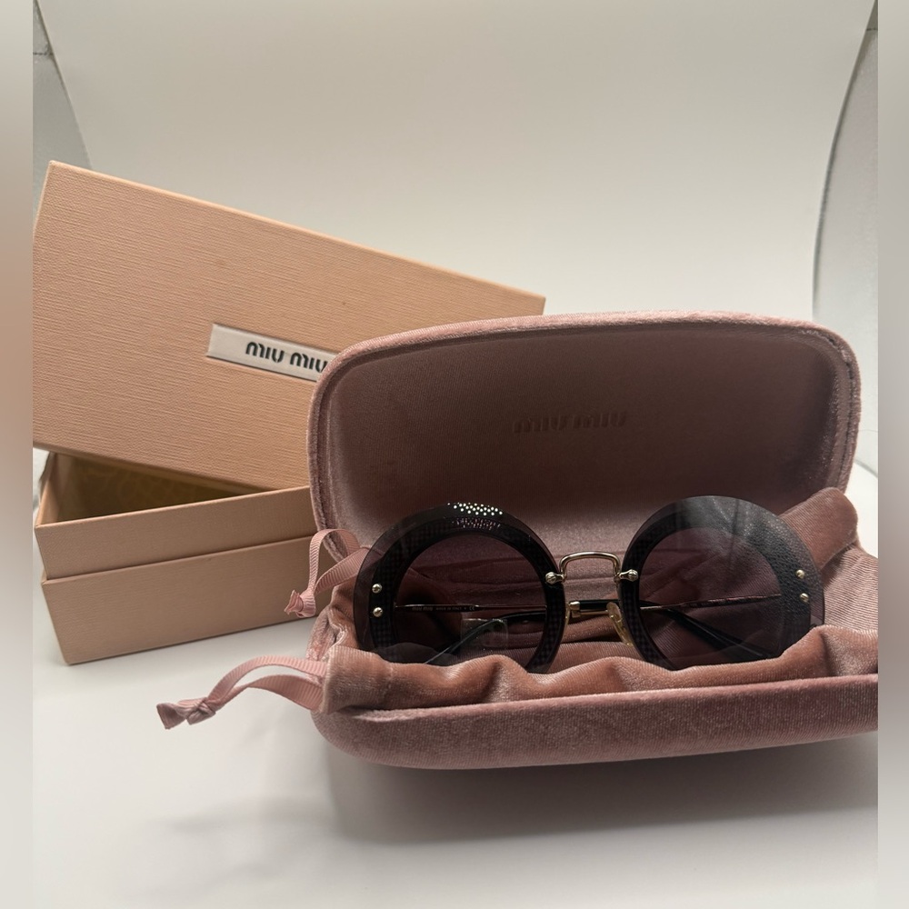 Miu Miu Reveal MU 10RS UES6S1 sunglasses purple/violet
